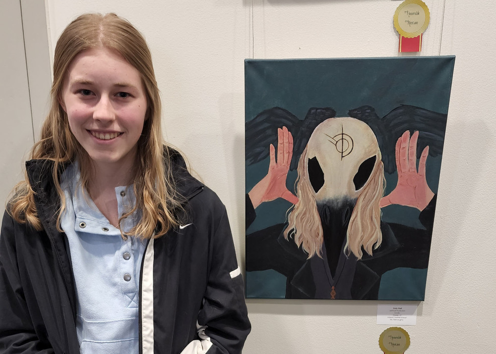 Emily Pfaff with her painting