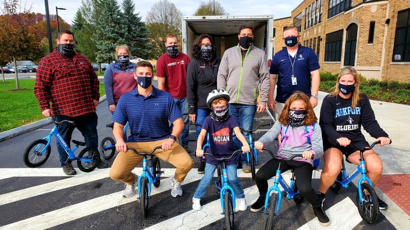 Arkport students and staff accept strider bike donation